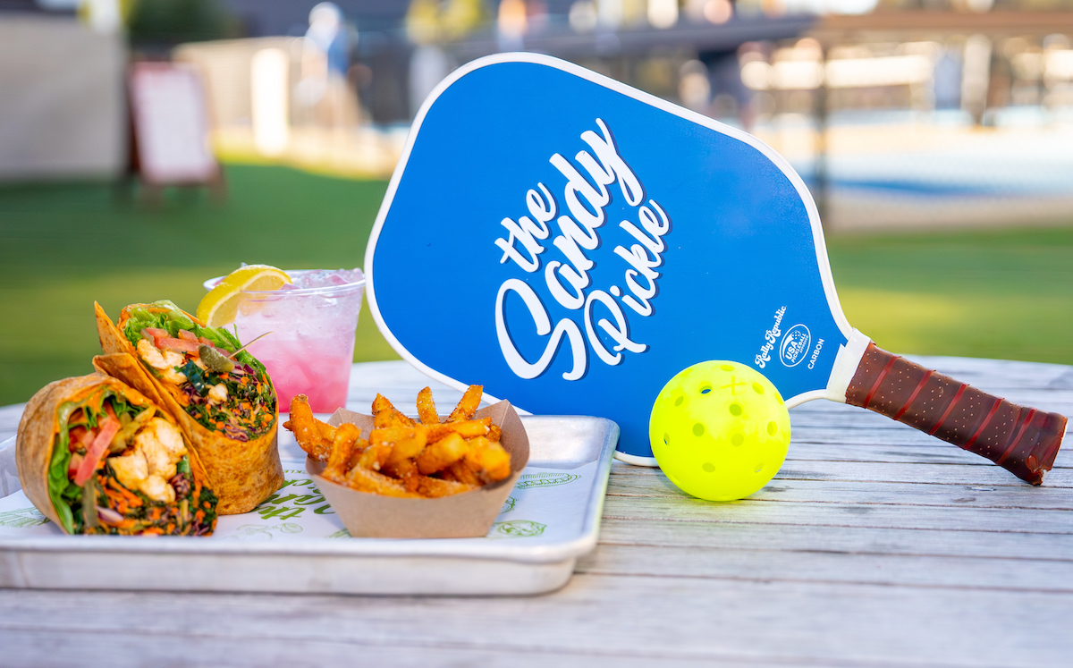 Food, drinks, and pickleball come together at The Sandy Pickle, an outdoor eatertainment destination in The Village. | Photo by The Sandy Pickle