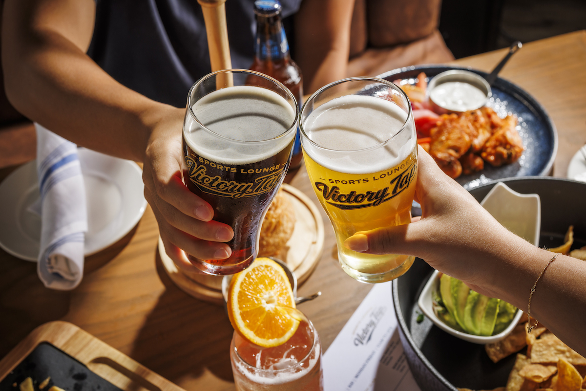 Beers and game-day bites set the scene at Victory Tap Sports Lounge in Plano, where guests can watch the action or get in on it themselves. | Photo by Samantha Marie Photography