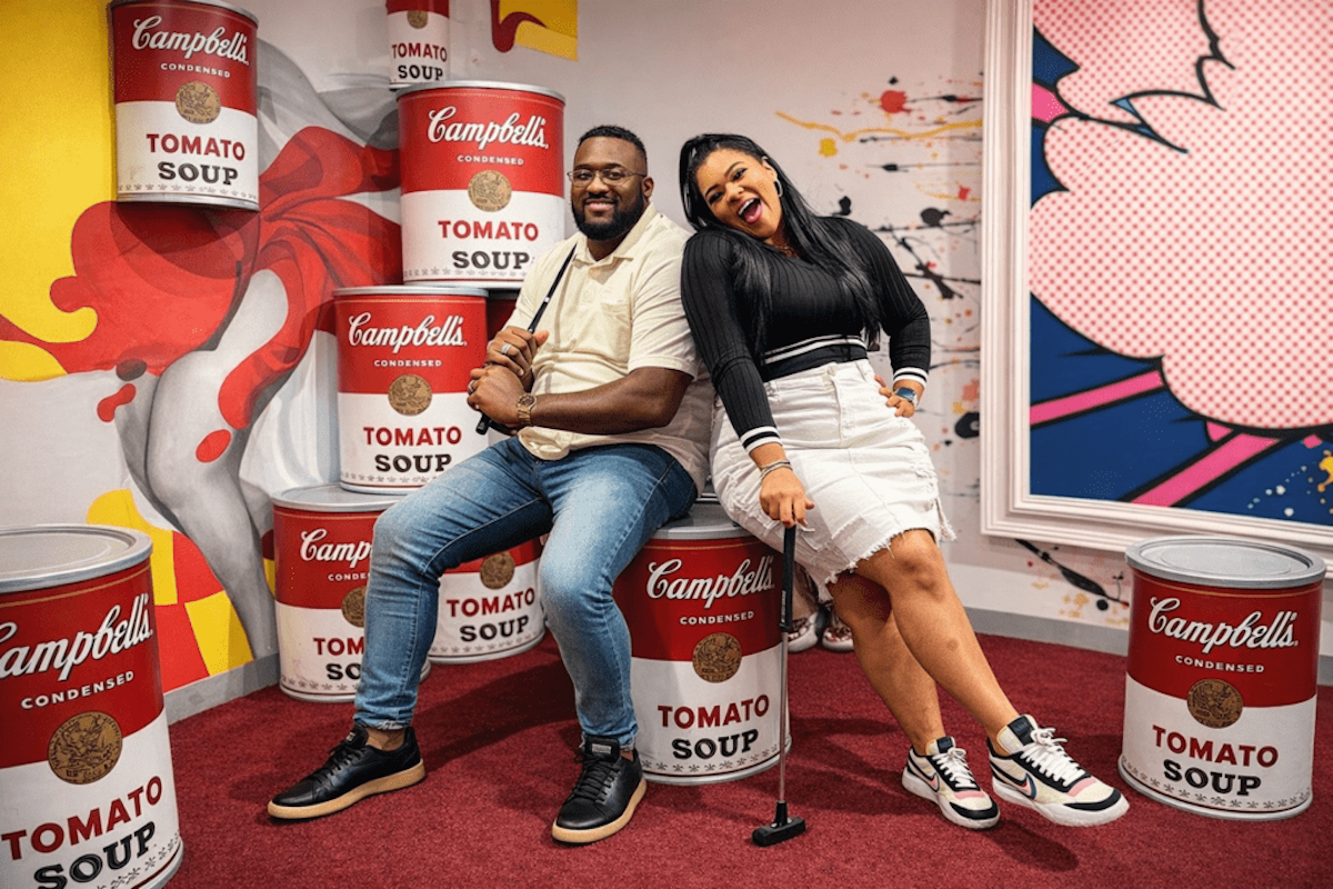 Guests strike a pose amid colorful pop art at Puttery, an immersive mini-golf destination that pairs themed courses with cocktails and food. | Photo by Puttery