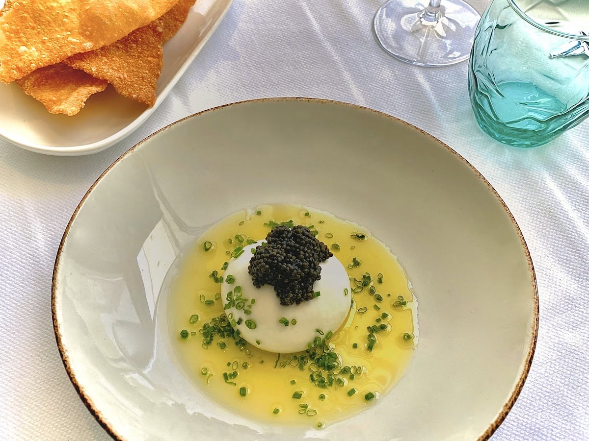 61 Osteria - DiningOut Russian Platinum Osetra over burrata, with early harvest olive oil and chives at 61 Osteria. | Photo by 61 Osteria