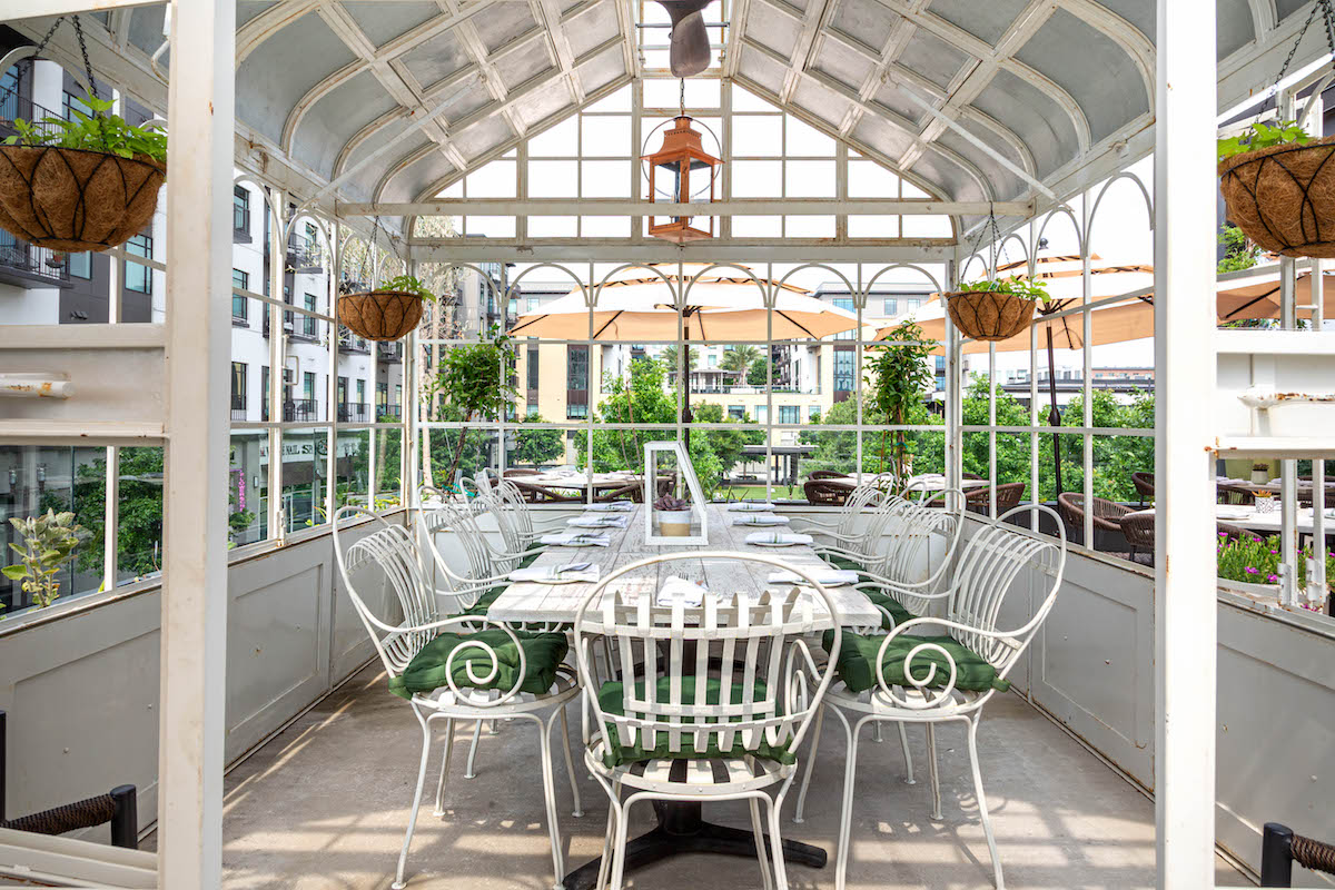 A peek inside one of two greenhouses on the rooftop terrace at Succulent. | Photo by Jenn Duncan