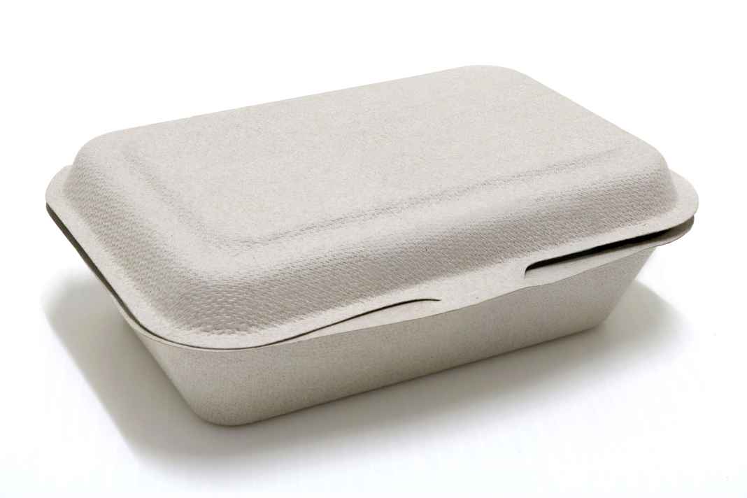 - DiningOut Paper takeaway food container on white background.