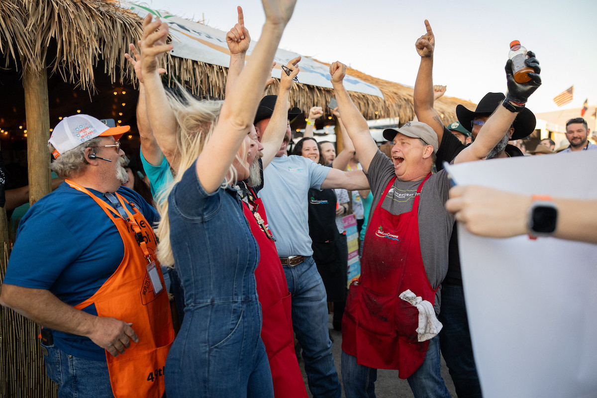 A barbecue team celebrates its win at the cook-off. | Photo by WCBBQ Committee Photographers 