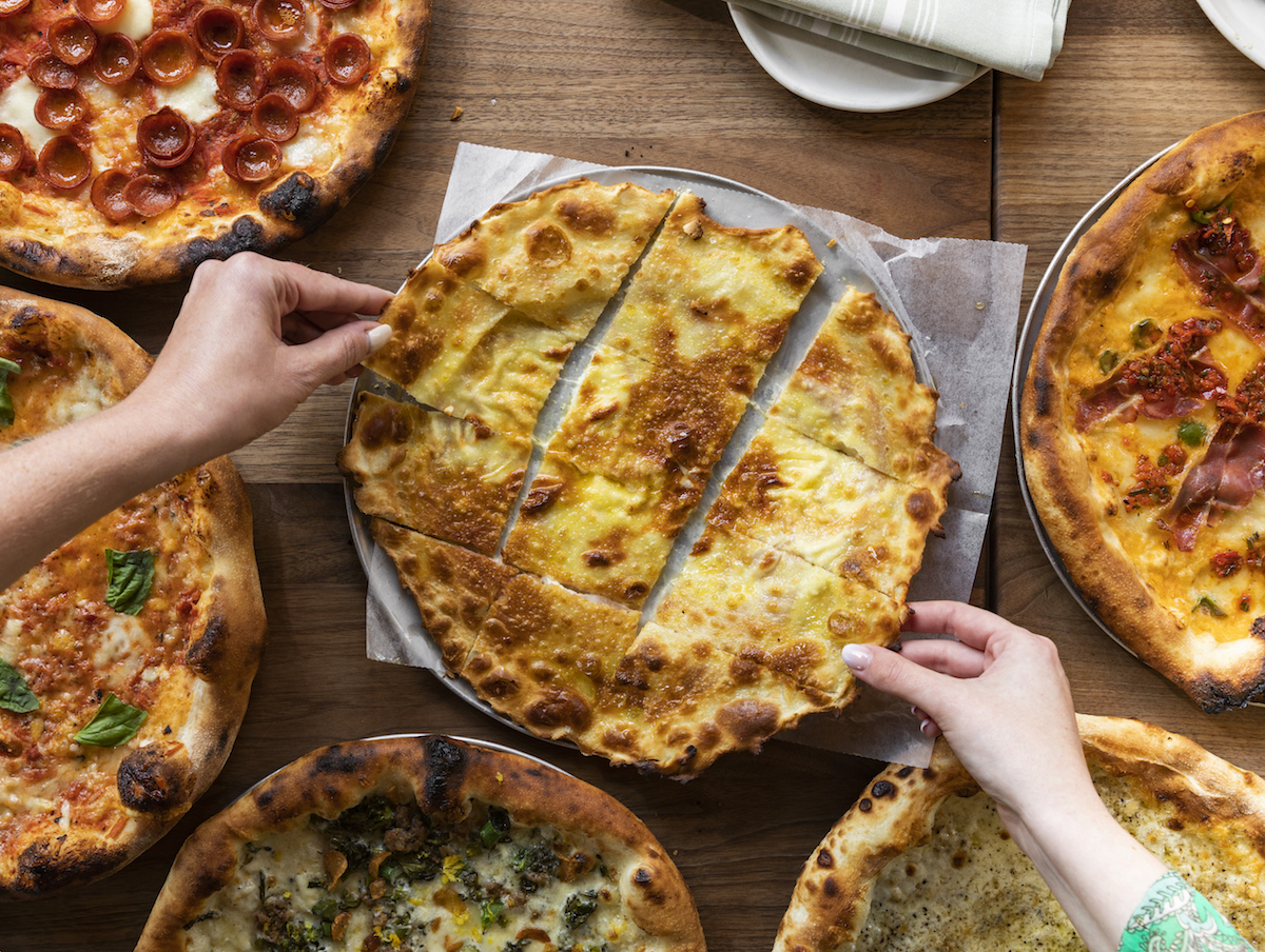 Sharing pizza at Rosie Cannonball. | Photo by Zach Horst
