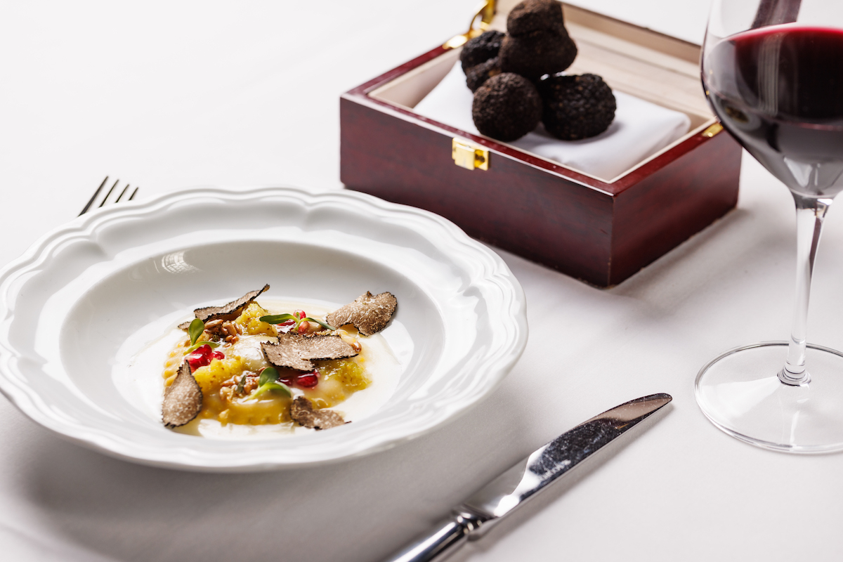 - DiningOut A dish gets finished off with freshly shaved truffles at Monarch. | Photo by S. Reynolds