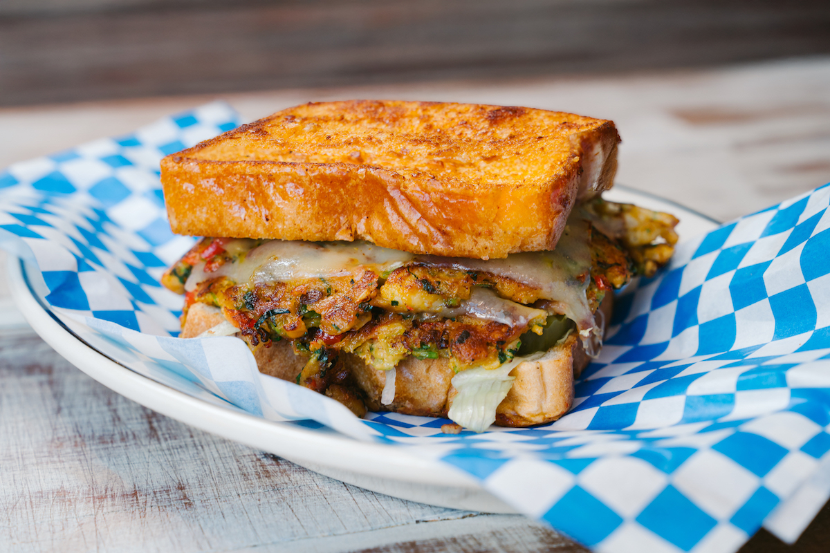 - DiningOut Global The Viet-Cajun crawfish patty melt, a collaboration for Burger Bodega's Guest Chef Series. | Photo by Rebekah Flores