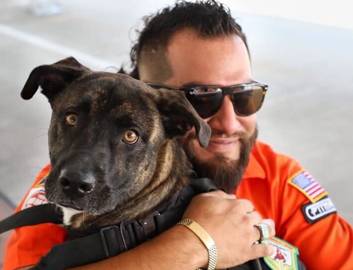 Arash Kharat, pitmaster of J-Bar-M BBQ and his dog, Roscoe, embrace. | Photo courtesy of Arash Kharat