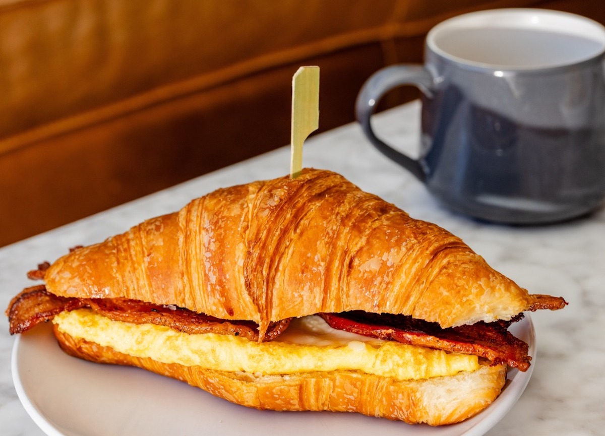 A bacon egg and cheese breakfast croissant at Ascension Coffee Roasters. | Photo by Ascension Coffee Roasters
