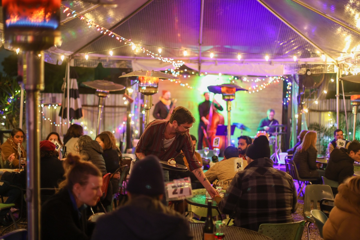 Inside the vibe at Bacchanal is all fun, food, and a really good music. | Photo by Dmitriy Pritykin