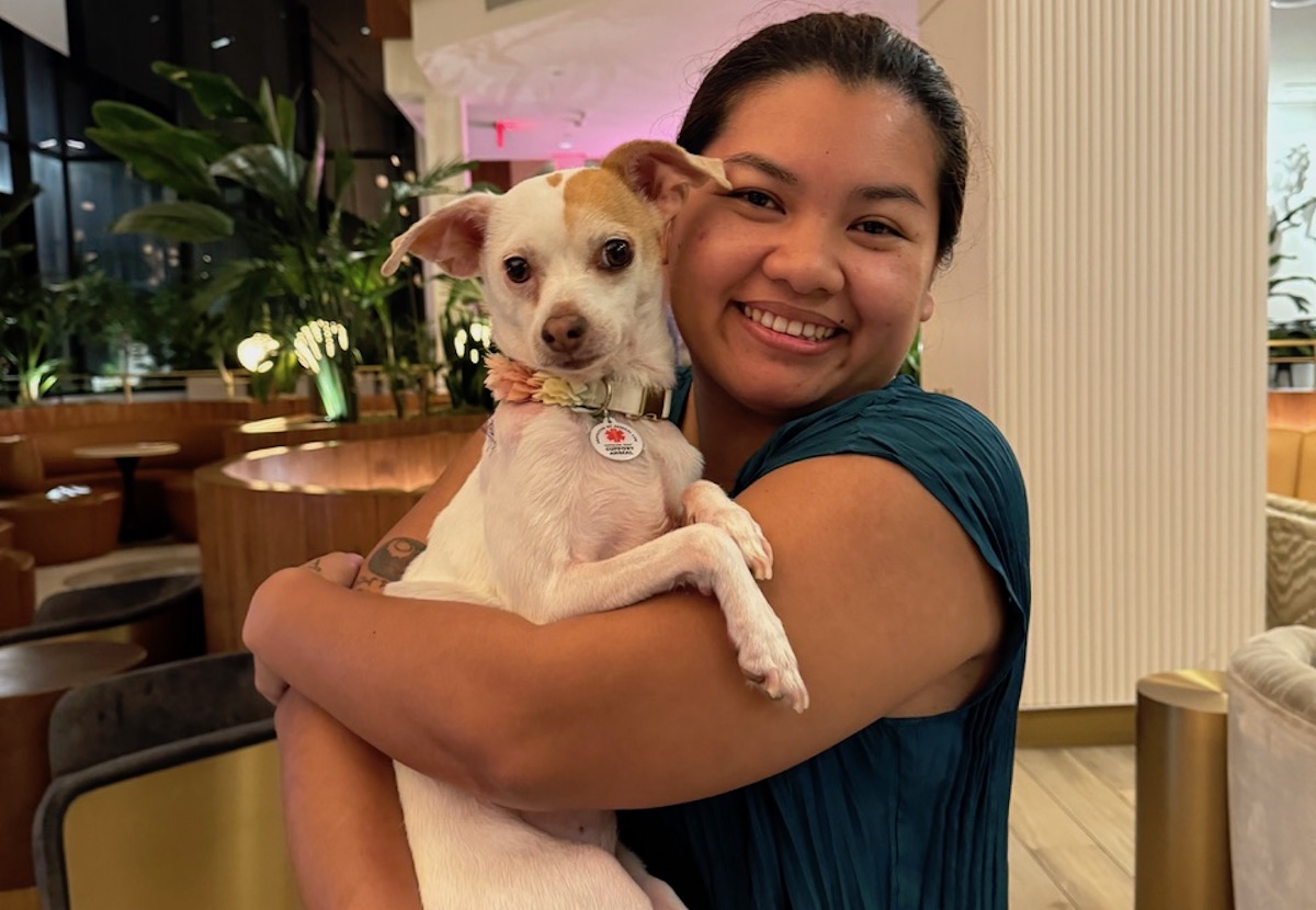 Street to Kitchen chef-owner, Benchawan Painter poses with her dog, Ms. Kitty. | Photo courtesy of Benchawan Painter 