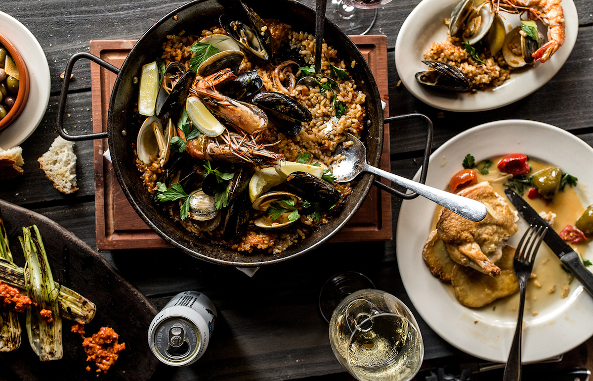 Paella with a spread of tapas at Barcelona Wine Bar. | Photo by Barcelona Wine Bar