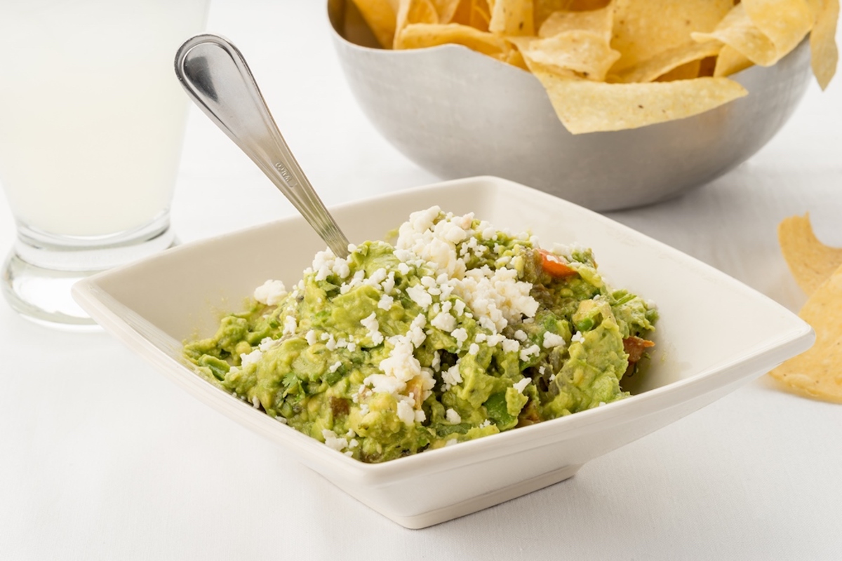Tableside guacamole at Cantina Laredo. | Photo by Cantina Laredo