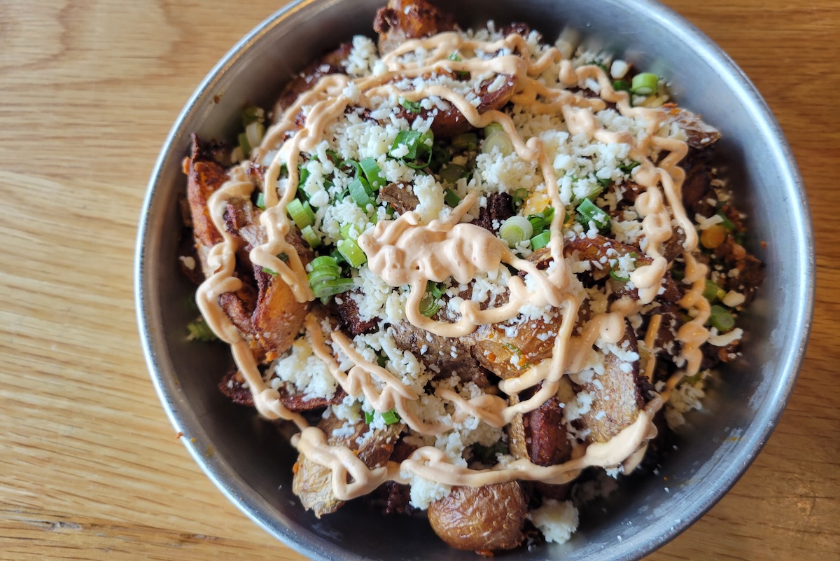 bowl of breakfast potatoes on wood table