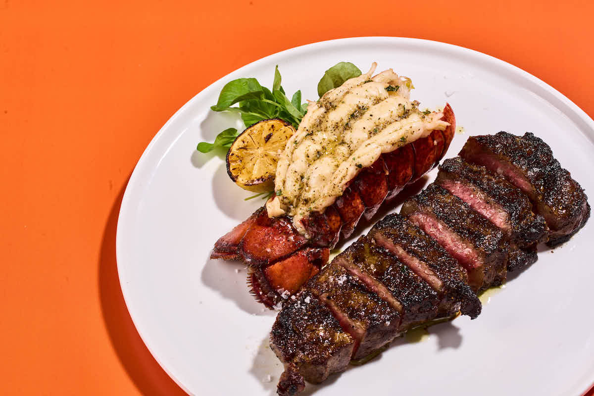 - DiningOut New York strip steak and lobster tail is on the Italian-inspired menu at the new Caramella restaurant and lounge at Planet Hollywood. | Photo by Tao Group Hospitality