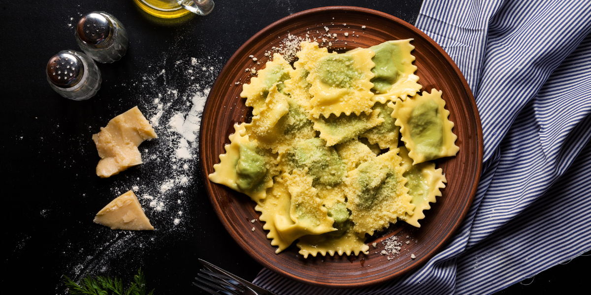 During National Pasta Month, we have been exploring the historical origins and varieties of noodles. Today, we celebrate the best one for holding the perfect amount of stuffing per bite with delicious flavors on National Ravioli Day. I recently participated in an Italian pasta making class and discovered the simplicity of making these noodles with its three ingredients: egg, flour, water, and using a ravioli stamp cutter. While a well-made vessel is important, the fun really comes from what you select as your filling. Whether you enjoy the traditional meat and cheese, or veer toward the vegetarian or sweet options, we have found four restaurants for you to go taste the delicious dish.