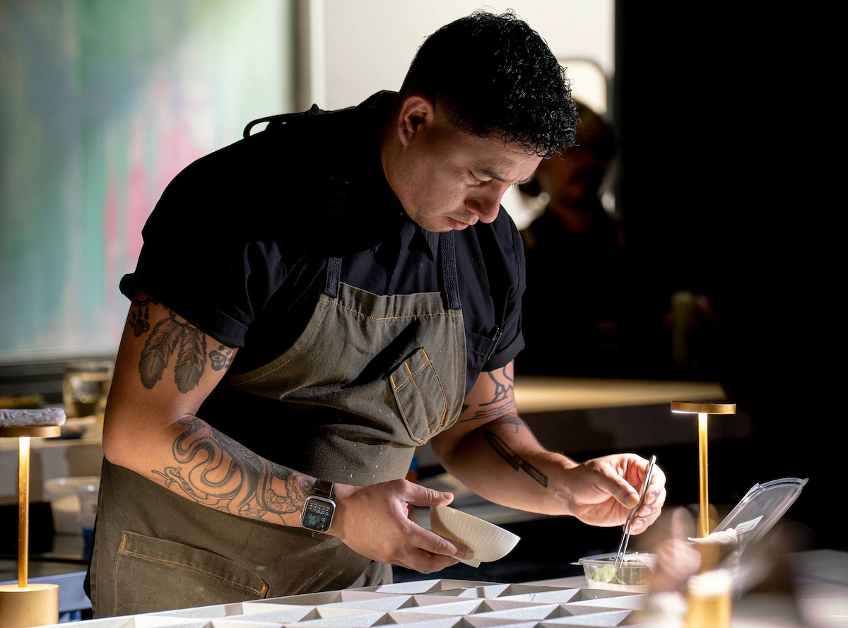 Chef Marcos Juarez plates in front of guests at Hidden Omakase. | Photo by Abante Photography
