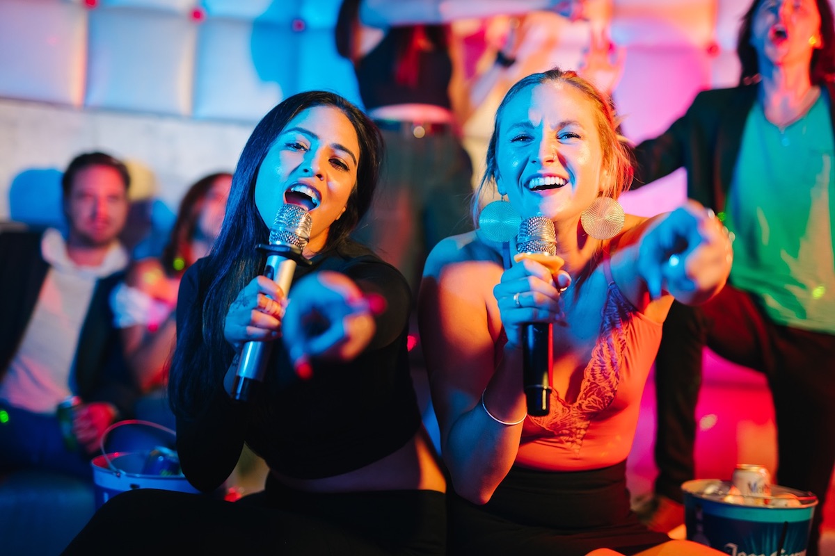 - DiningOut A duo sings to the crowd at City Night KTV. | Photo by City Night KTV