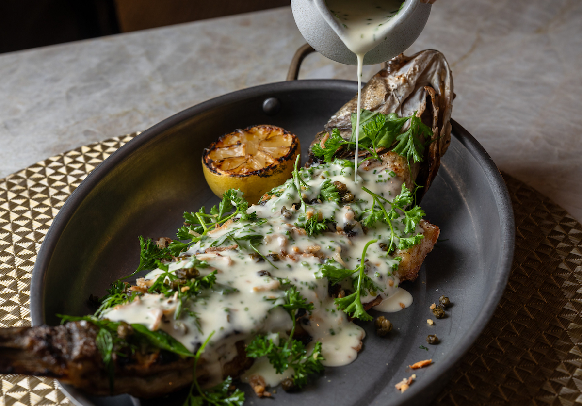 Hearth-roasted whole fish at Credence. | Photo by Brian Kennedy