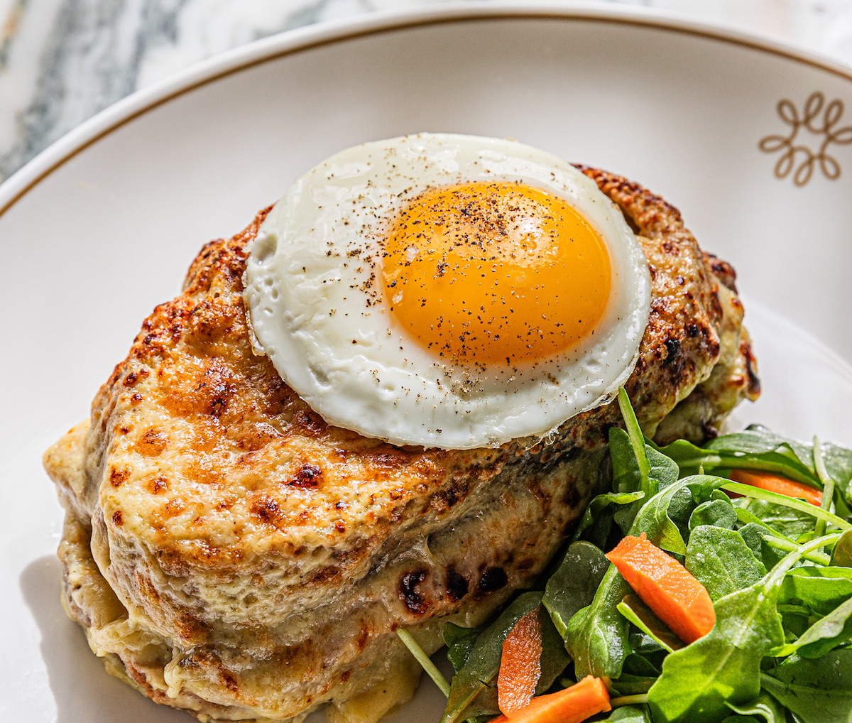- DiningOut Global Croque madame at the Marigold Club. | Photo by Zach Horst