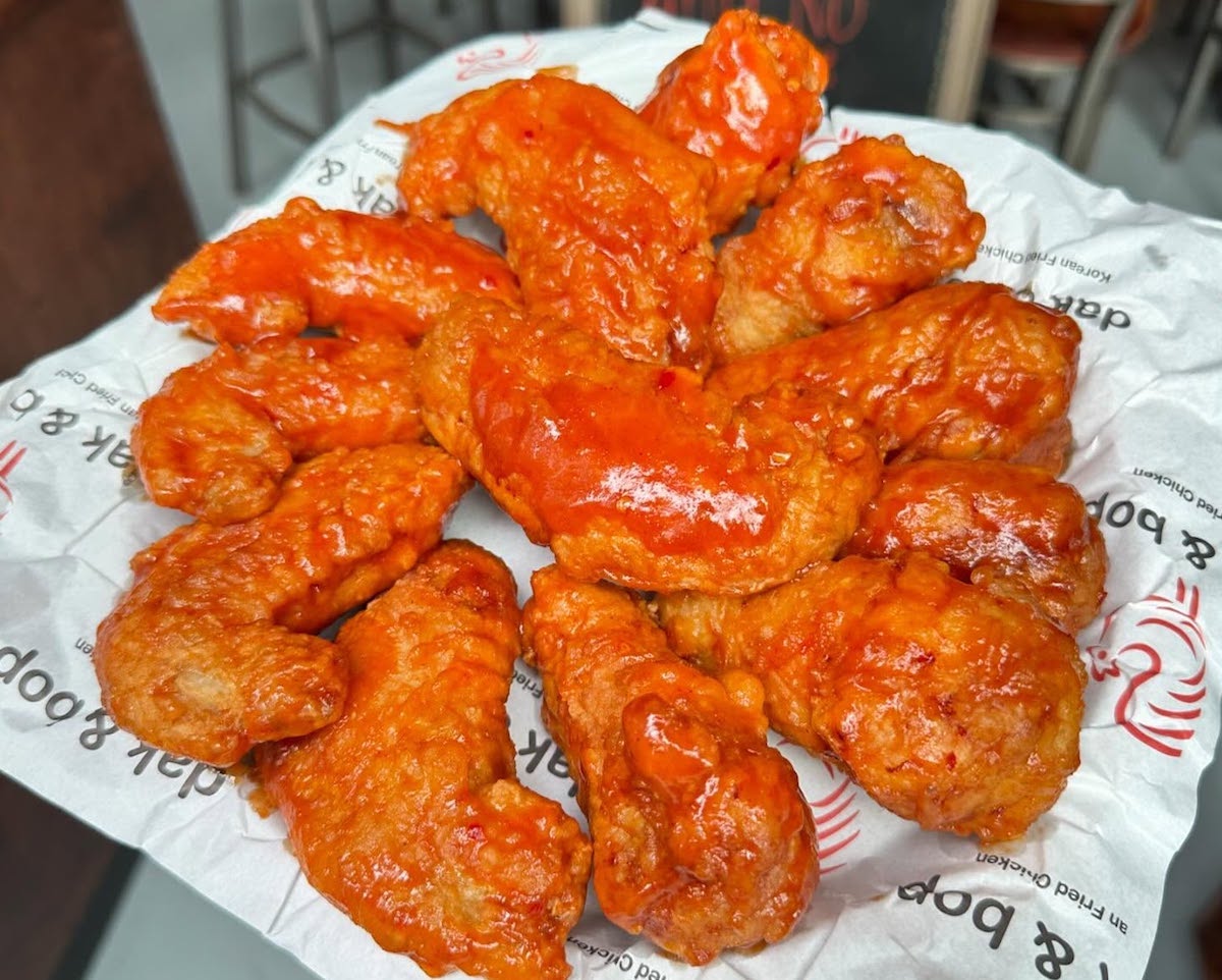 A platter of saucy Korean fried chicken at Dak & Bop. | Photo by Dak & Bop