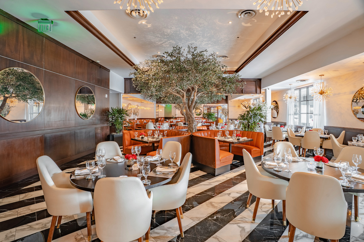 Olive trees anchor the main dining room at Truluck's Houston. | Photo by Truluck's