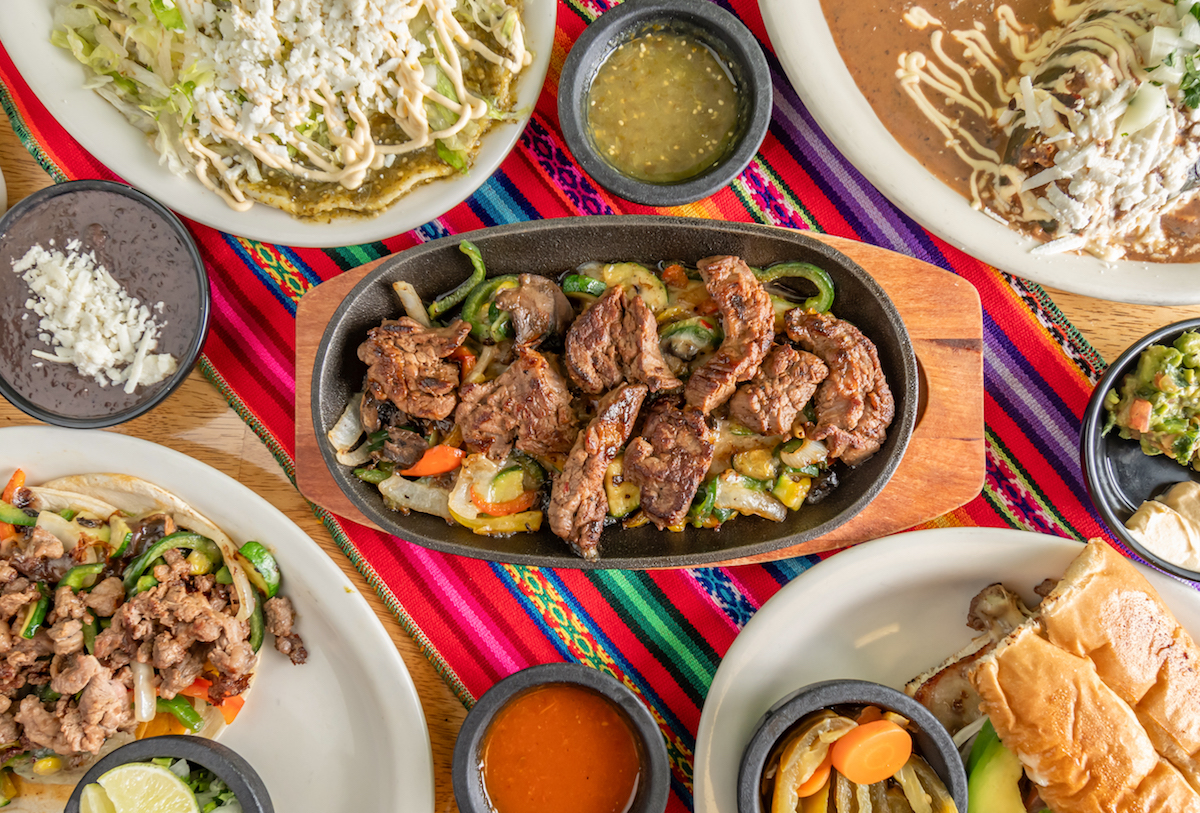 A spread of tacos, fajitas, and enchiladas at Domingo. | Photo by Domingo