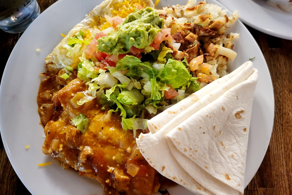 white plate with chile rellenos and tortilla