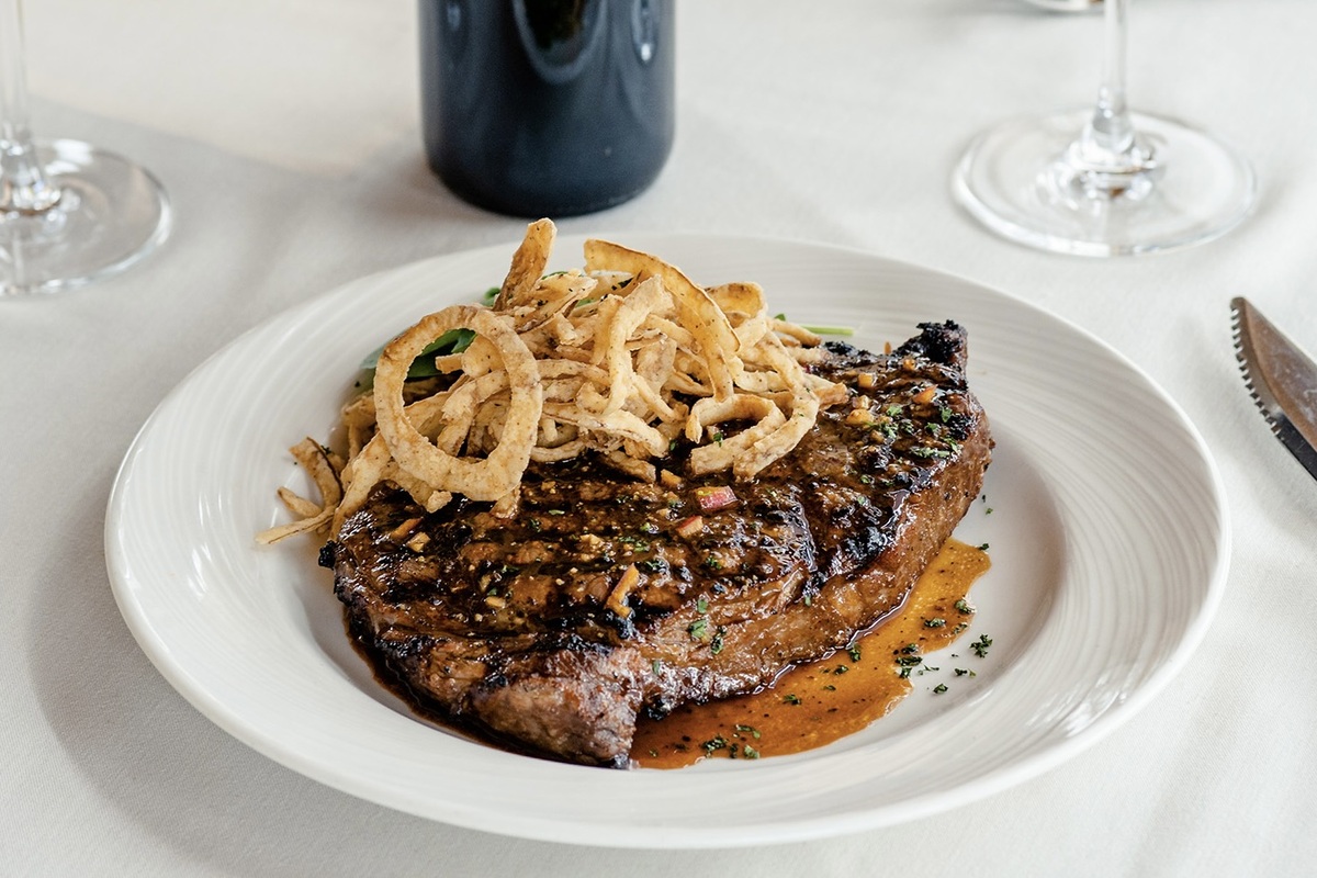 A sixteen-ounce prime ribeye marinated in bourbon and brown sugar | Photo by Eddie Merlot's