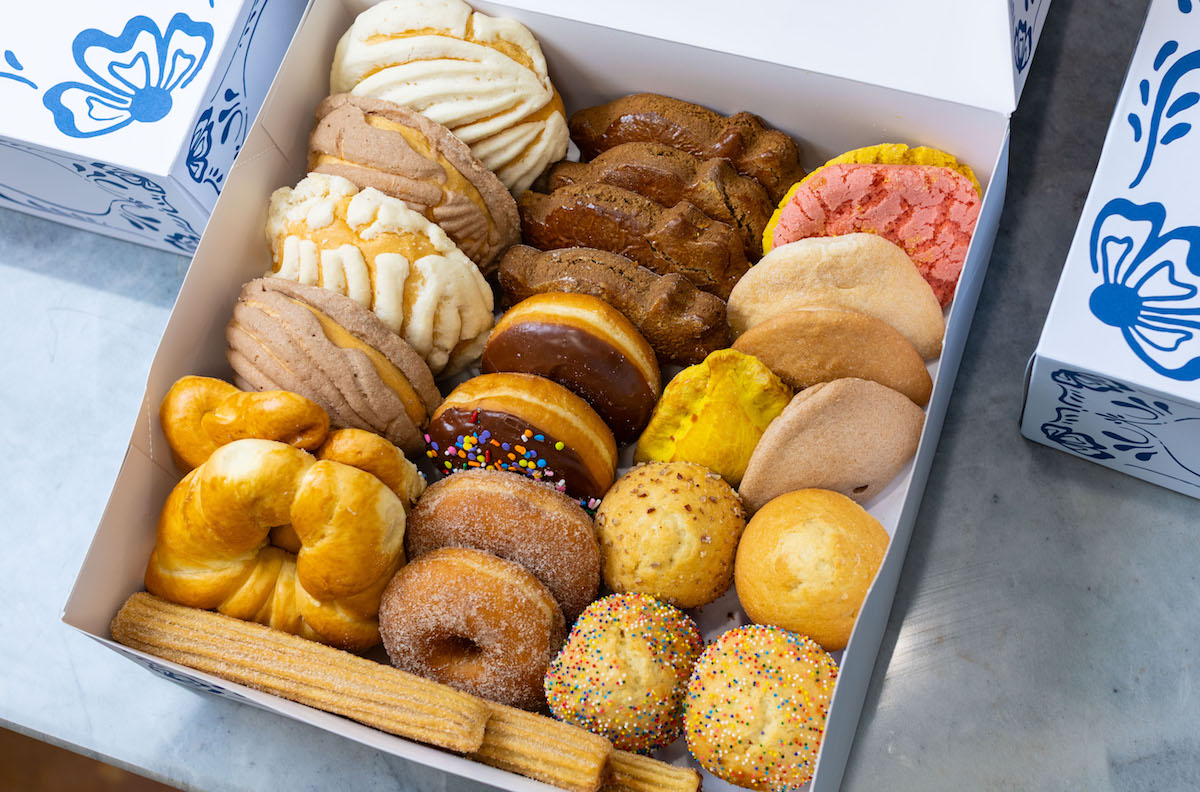 A box of assorted pastries, including doughnuts and concha at El Bolillo. | Photo by Andrew Hemingway