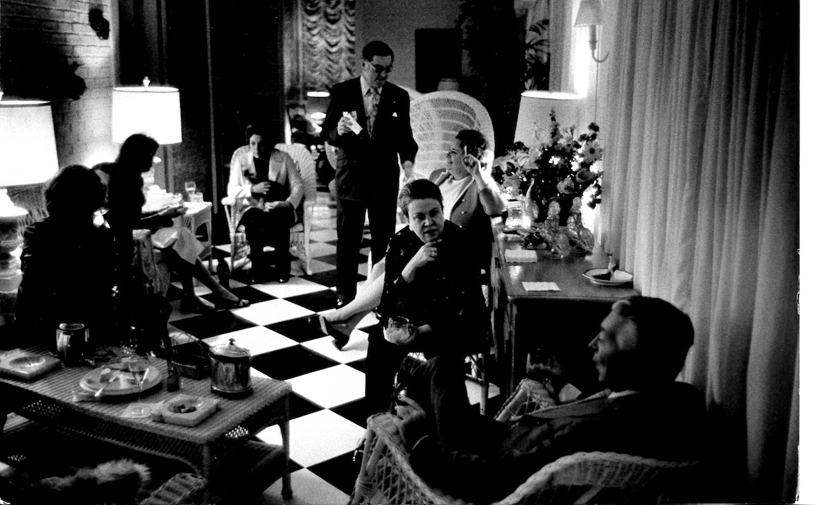 A vintage photo of Ella Brennan with the black-and-white floor inspiration for Brennan's Courtyard Bar. | Photo by Brennan's of Houston