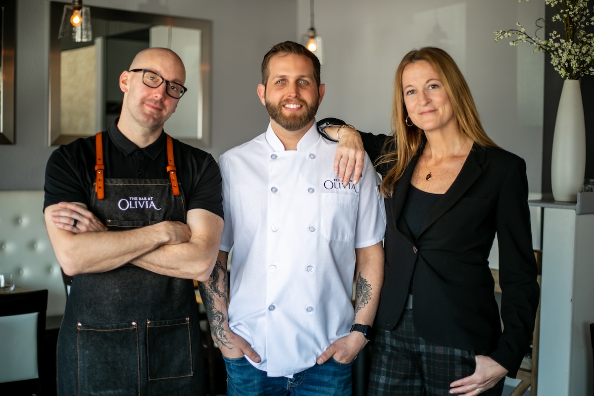 Husband and wife team Austin Carson (left) and Heather Morrison (right) own Restaurant Olivia along with chef Ty Leon (center). | Photo by Restaurant Olivia
love