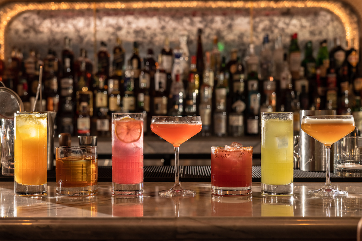 A variety of cocktails on the bar top at Ginger's. | Photo by Ginger's