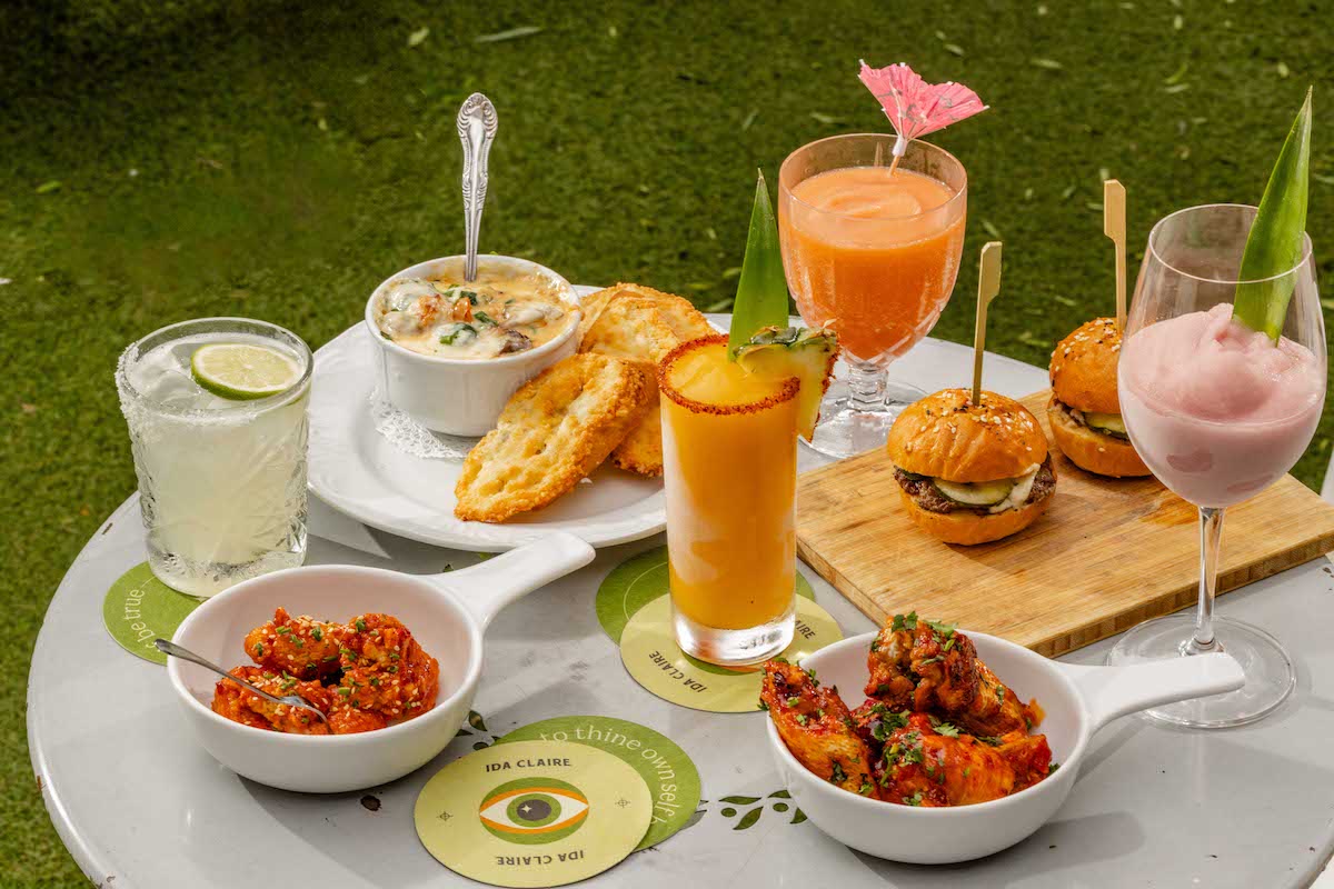 A spread of happy hour food and frozen cocktails at Ida Claire. | Photo by Ida Claire