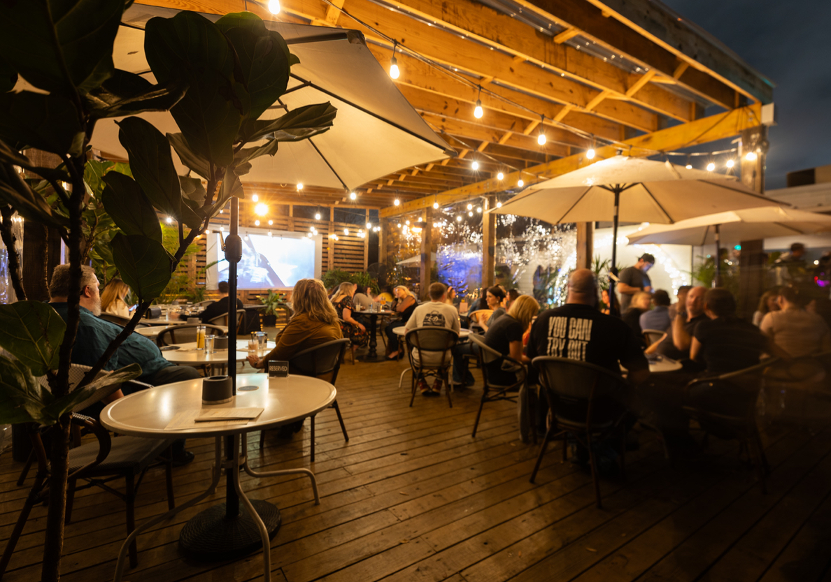 The illuminated patio at Heights & Co. at night. | Photo by Heights & Co.