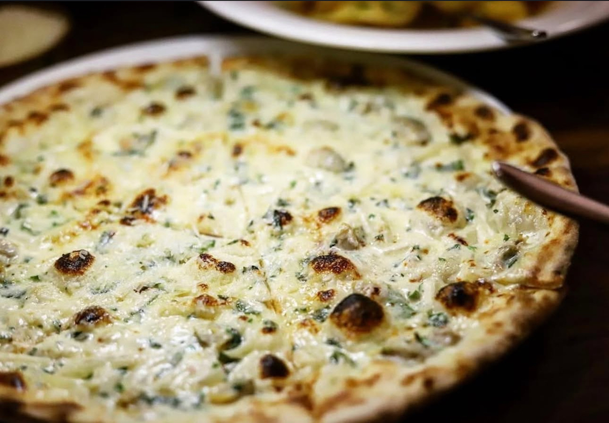- DiningOut Nonna's famed white clam pie. | Photo by Nonna