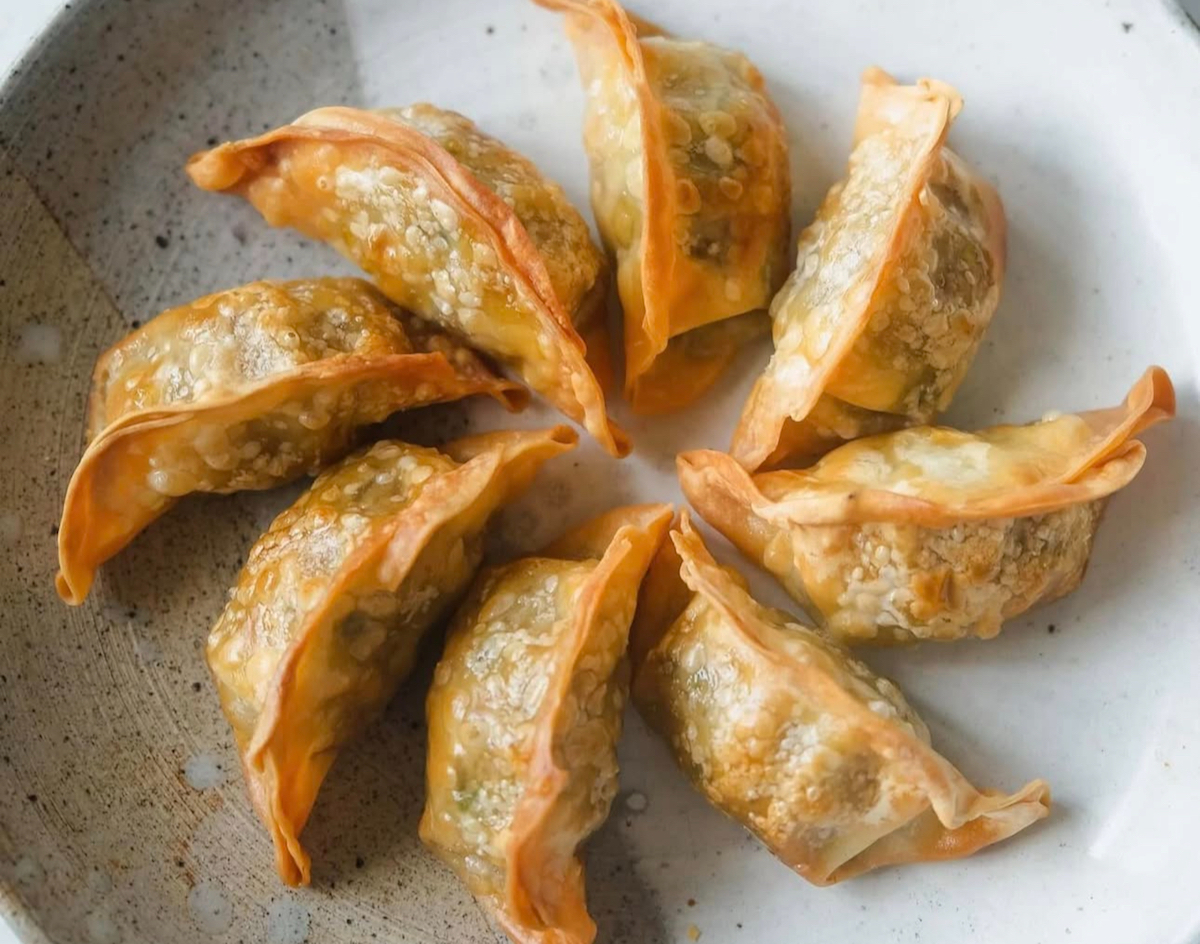 - DiningOut Pan-fried dumplings at China Queen. | Photo by China Queen