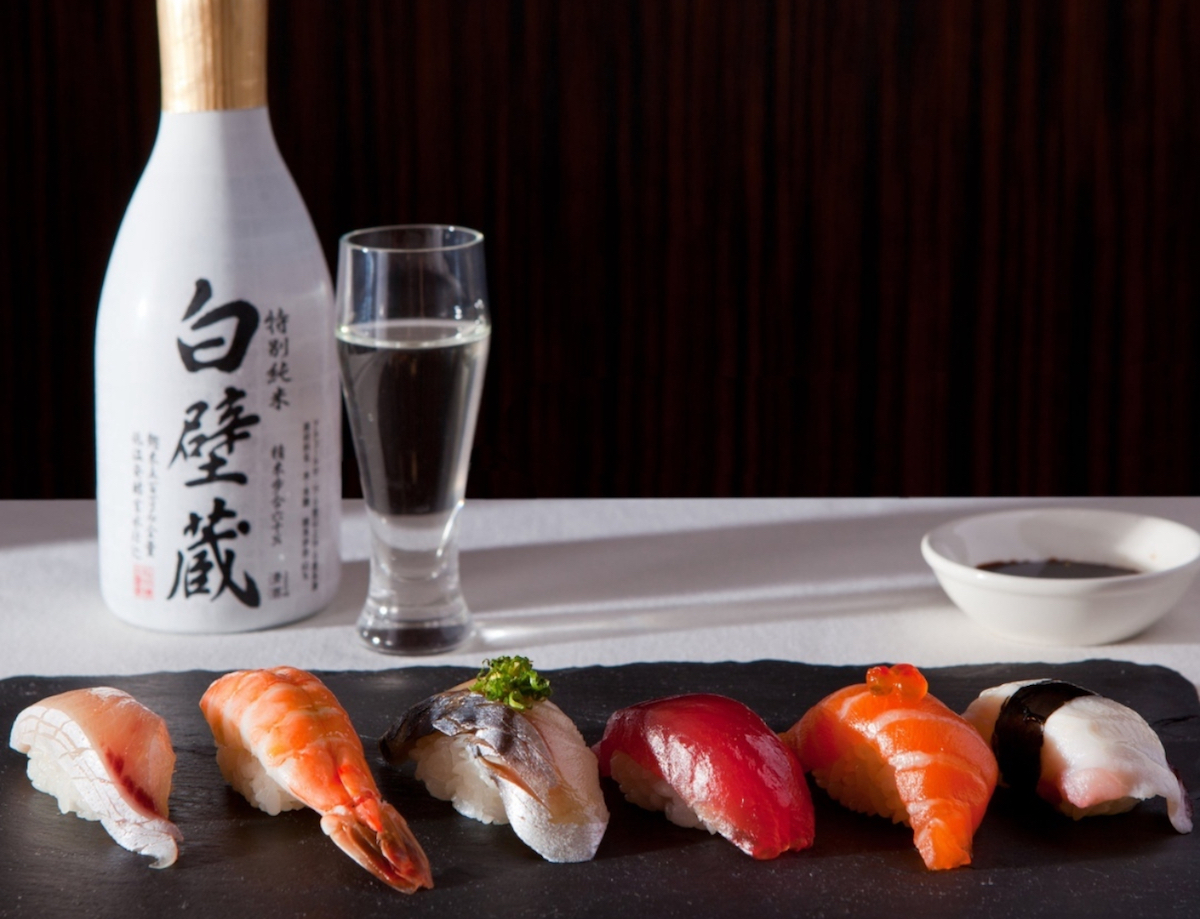 A sampling of nigiri and a bottle of sake at Uptown Sushi. | Photo by Uptown Sushi