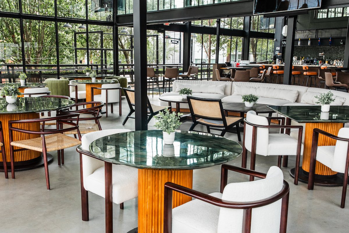 The glass-enclosed interior bar at Solarium. | Photo by Becca Wright