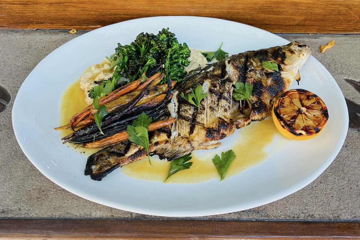 Jax_Fish_House_and_Oyster_Bar_Whole_Grilled_Alamosa_Striped_Bass - DiningOut One of the past specials at Jax, a roasted Alamosa striped bass. | Photo by Big Red F