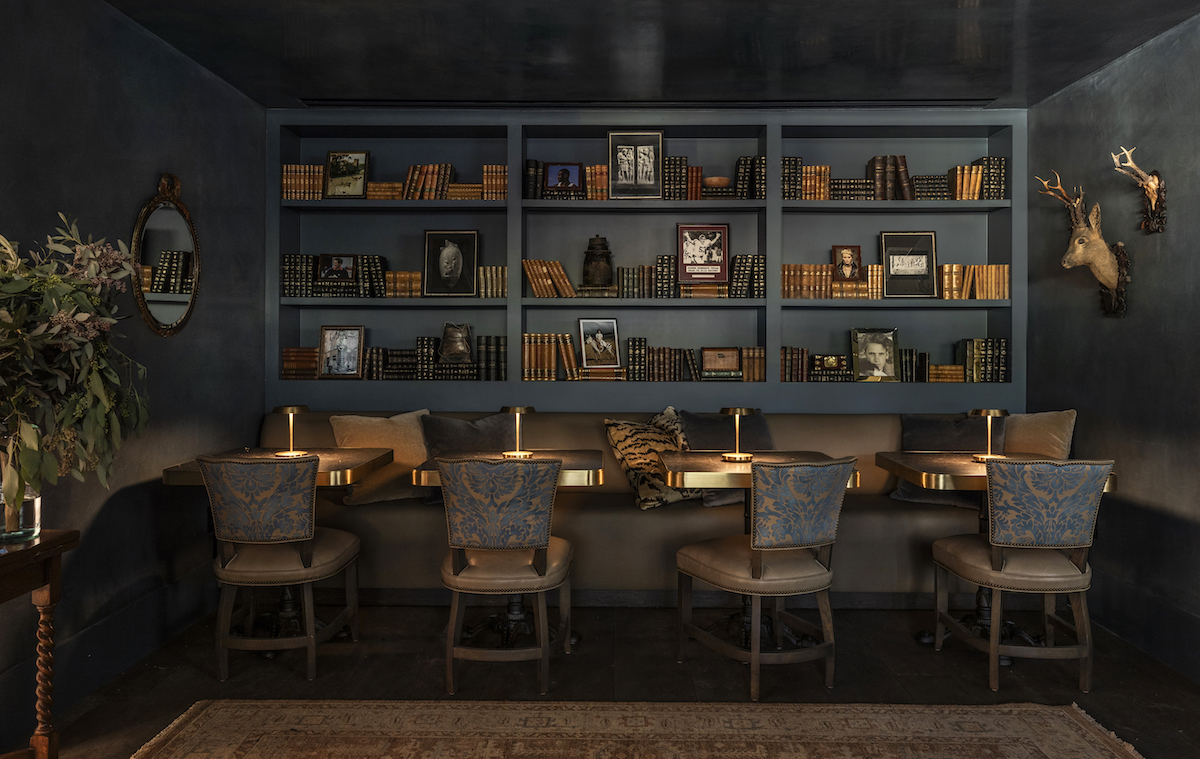 Guests can enjoy cocktails from Bar Remi in the Library, a warm and moody retreat within the Hotel Granduca. | Photo by Julie Soefer