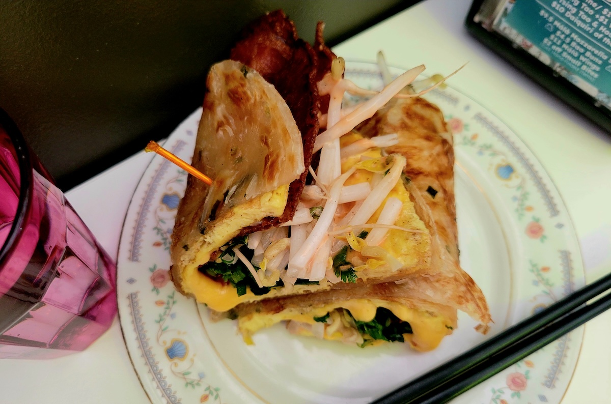 - DiningOut Order the bacon, egg, and cheese jian bing during brunch at MAKfam. | Photo by Linnea Covington