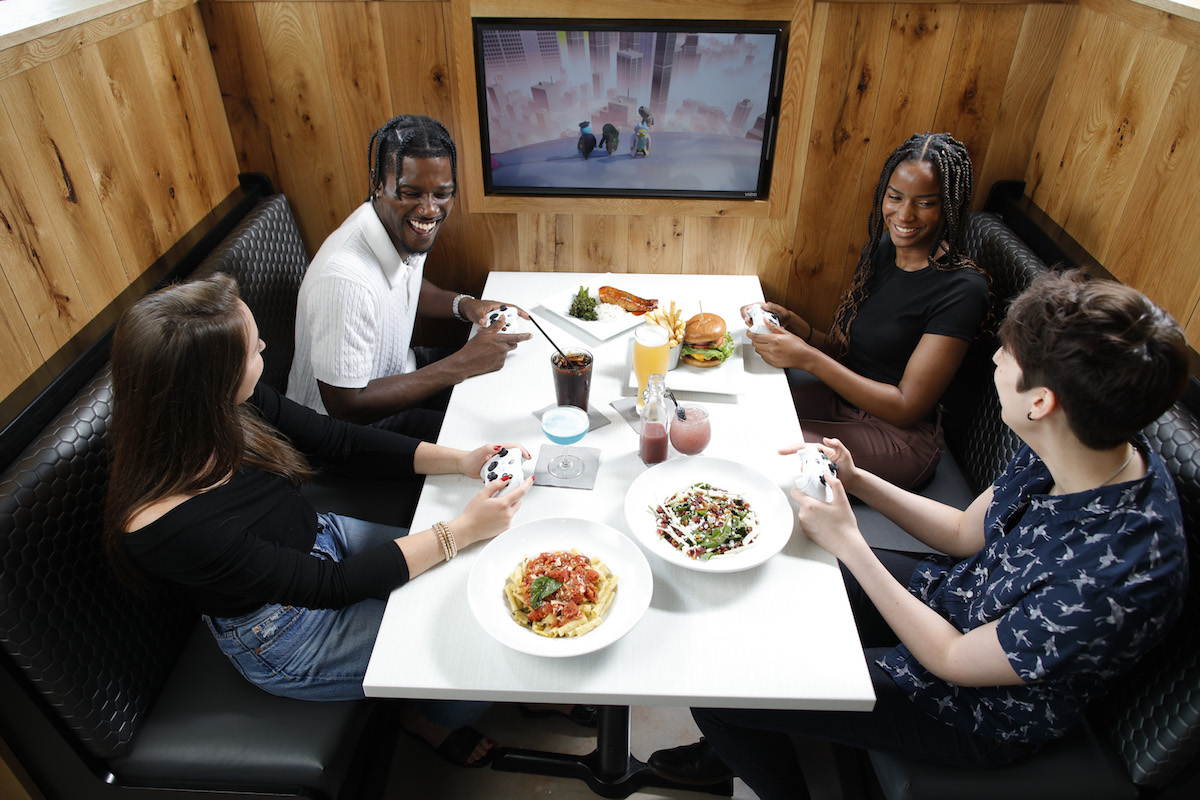 A booth fitted with video games at Nerdvana. | Photo by Nerdvana