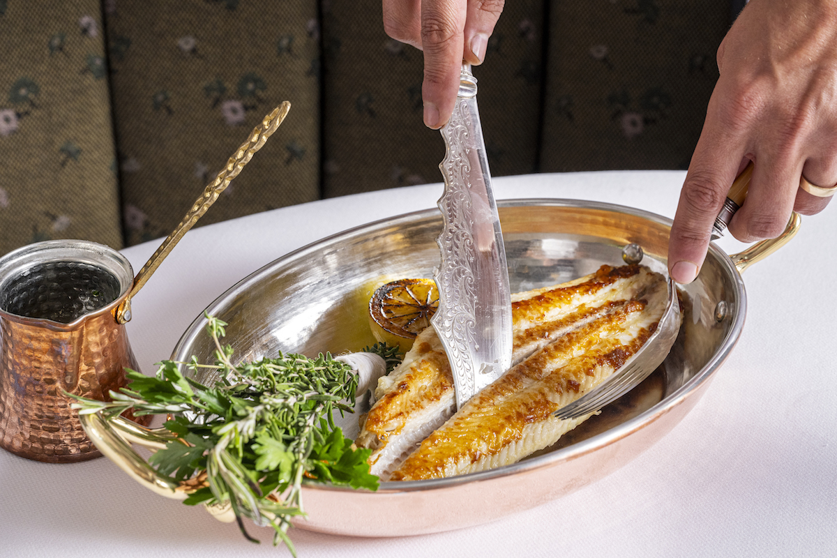 Fish served tableside at Mister Charles. | Photo by Lindsey Miller PR