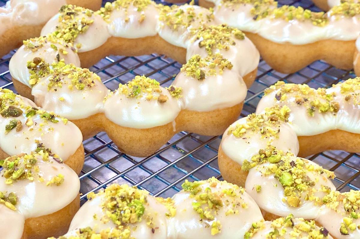 Mochio's signature rings iced and topped with pistachio. | Photo by Mochio Mochi Donut