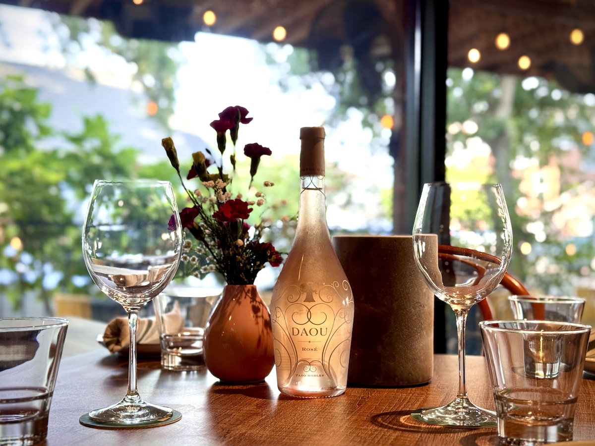 - DiningOut A bottle of DAOU rosè on the patio at Alora. | Photo by Alora
