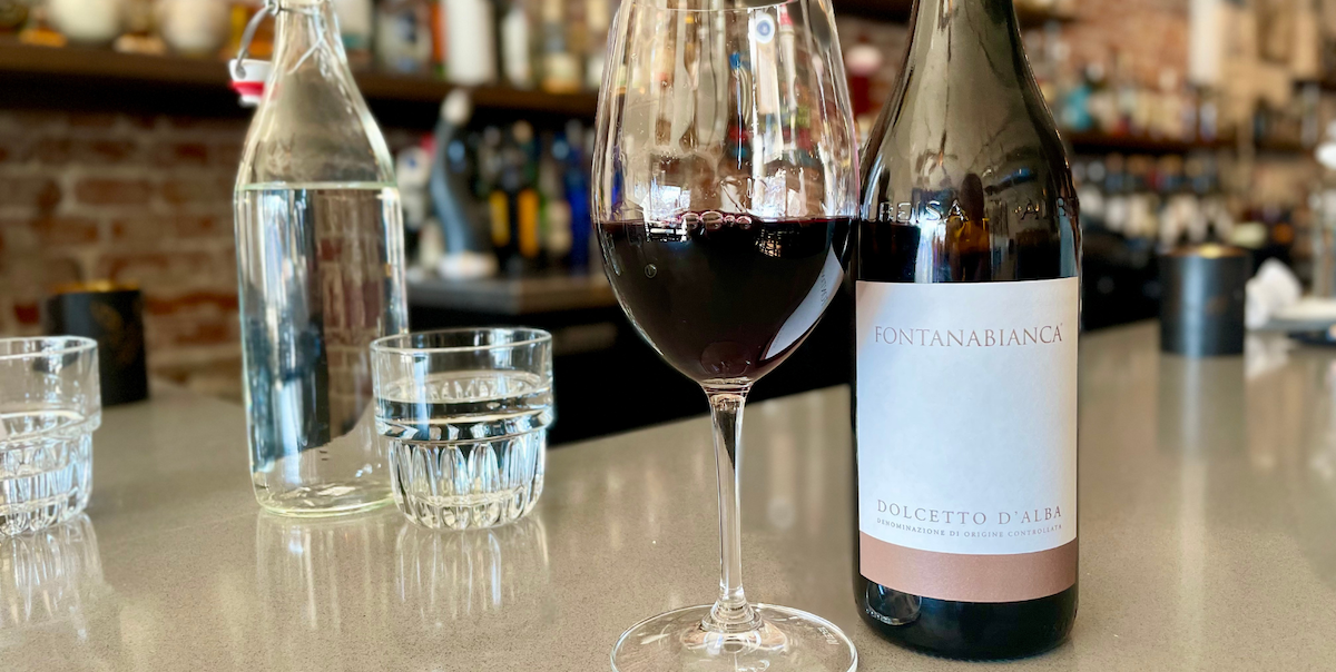 glass of red wine on bar