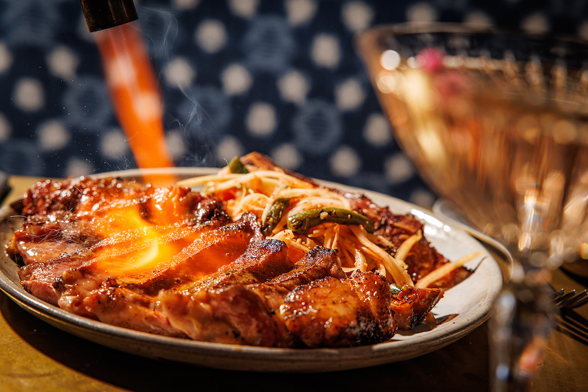 Uni butter torched tableside at Norman's. | Photo by Samantha Marie Photography
