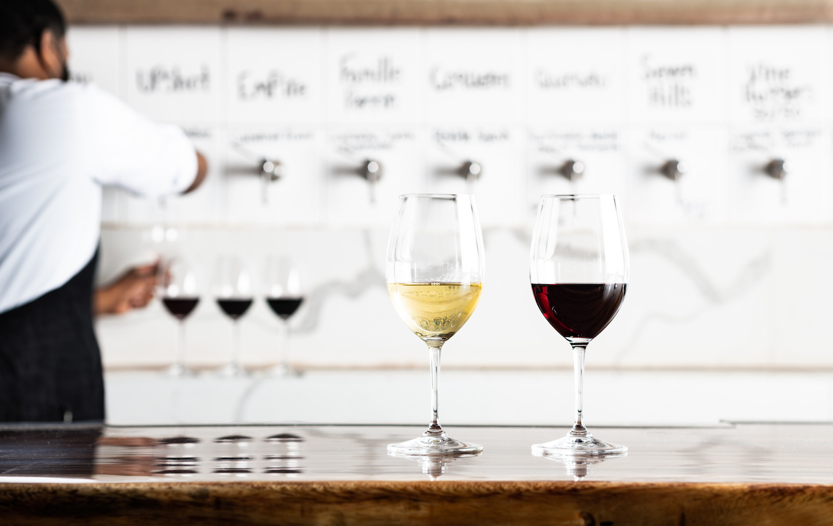 Glasses of vino against the tap wall at Sixty Vines. | Photo by Sixty Vines