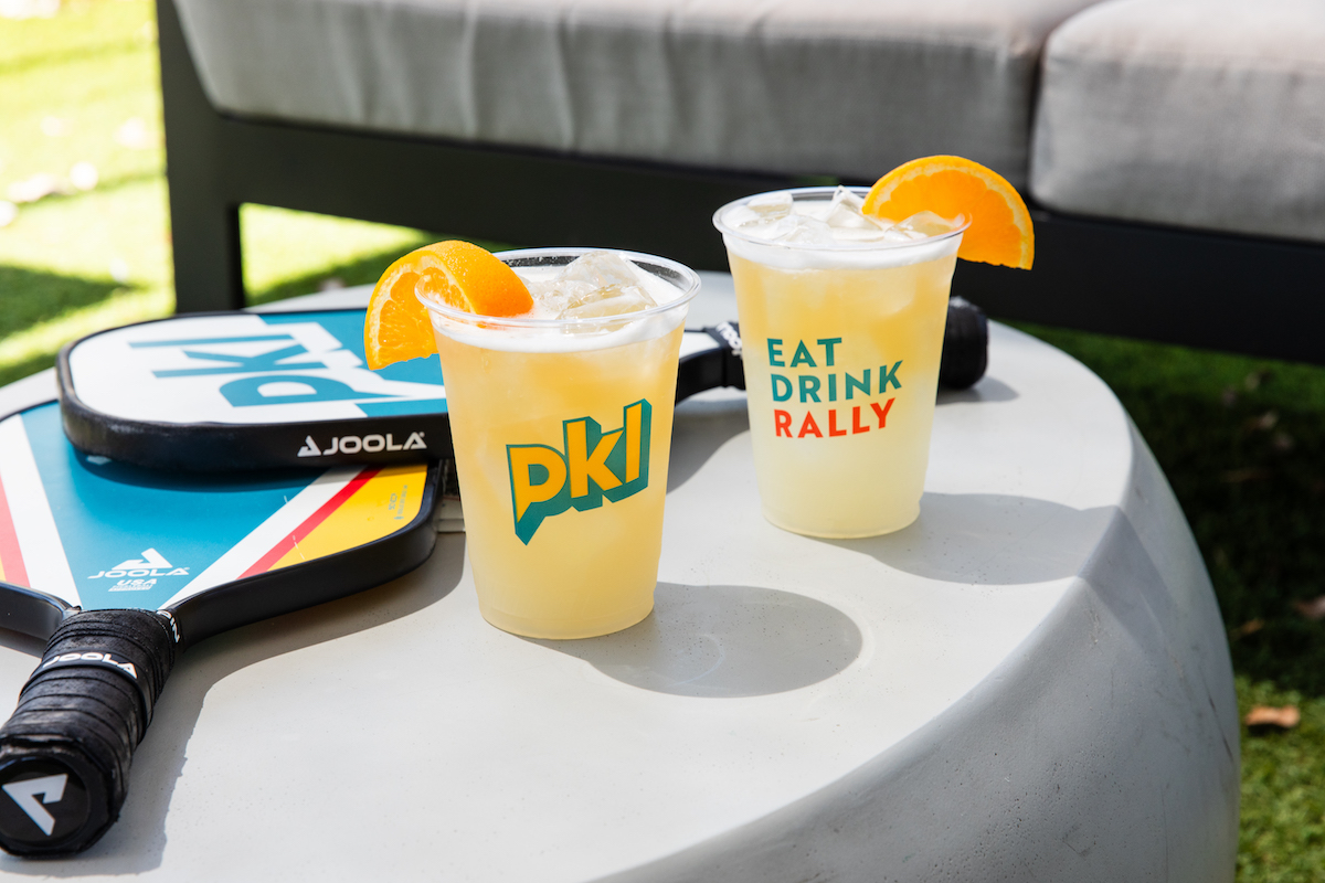 - DiningOut Beer and pickle ball paddles at PKL Social. | Photo by Becca Wright