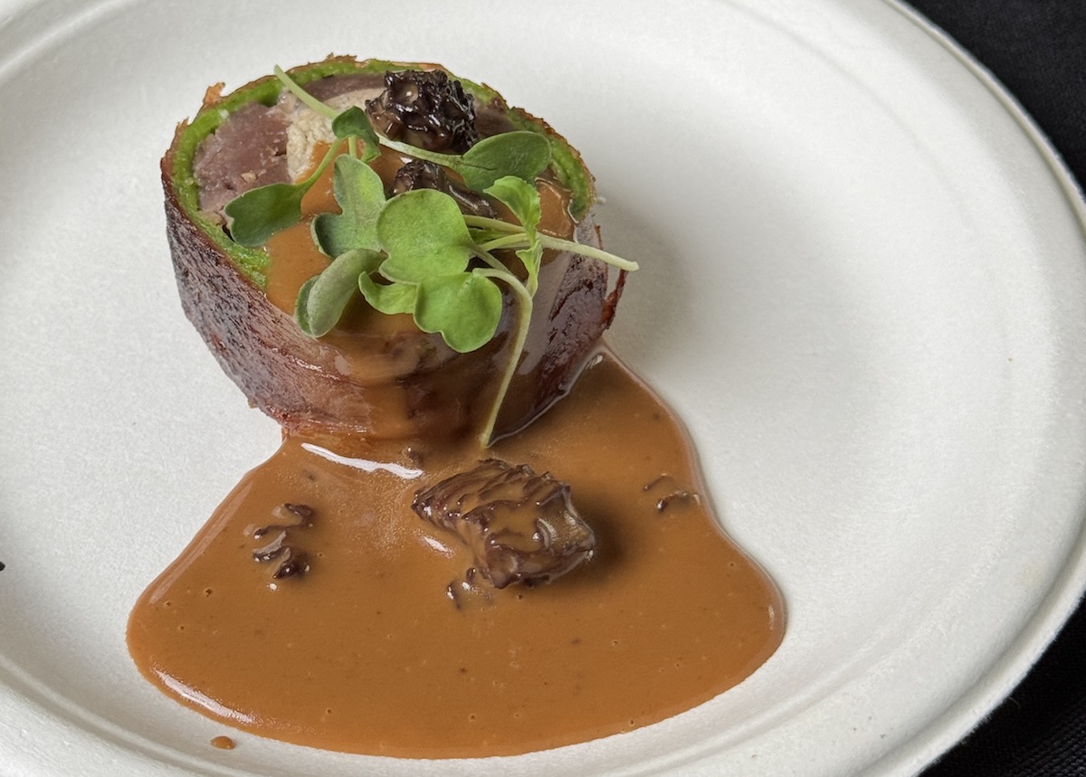 Photo Oct 23 2025 5 30 56 PM - DiningOut Georgia James' seared striploin rolled with foie gras mousse, wrapped in prosciutto and spinach crêpe, with morel mushroom sauce at the 2025 RARE Steak Championship in Houston. | Photo by Zain Mohammed